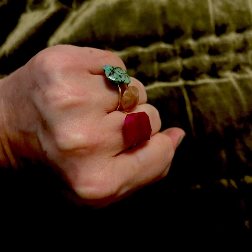 Three rings with green and pink stones